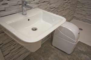 Close up of wash basin and shower bath exhibit 5 Ocean Bathrooms By Design showroom picture in Salisbury Wiltshire