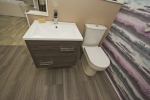 Square shaped wash hand basin with toilet exhibit by Ocean Bathrooms By Design showroom picture in Salisbury Wiltshire