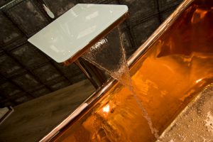Water close up over Copper bath from Ocean Bathrooms By Design in Salisbury