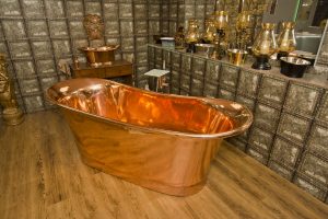 Copper bath close up and accessories from Ocean Bathrooms By Design in Salisbury