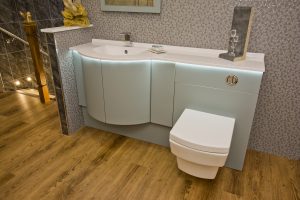 Contemporary bath unit with light under counter top from Ocean Bathrooms By Design in Salisbury