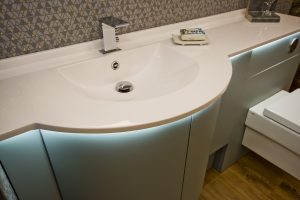 Contemporary bath unit with light under counter top from Ocean Bathrooms By Design in Salisbury
