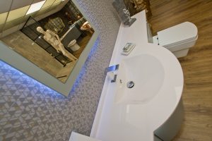 Contemporary bath unit with light under counter top from Ocean Bathrooms By Design in Salisbury