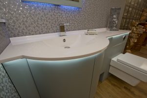 Contemporary bath unit with light under counter top from Ocean Bathrooms By Design in Salisbury