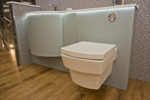 Contemporary bath unit with light under counter top from Ocean Bathrooms By Design in Salisbury