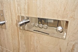 Contemporary shower control unit in marble wall from Ocean Bathrooms By Design in Salisbury