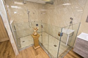 Contemporary shower unit with marble wall from Ocean Bathrooms By Design in Salisbury