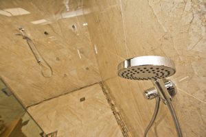Contemporary shower unit with marble wall from Ocean Bathrooms By Design in Salisbury
