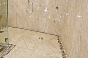 Contemporary shower unit with marble wall from Ocean Bathrooms By Design in Salisbury