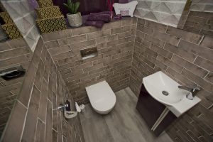 Toilet and tiled walls and basin display 6 by Ocean Bathrooms By Design in Salisbury