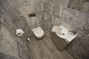 Toilet and tiled walls and basin display 2 by Ocean Bathrooms By Design in Salisbury