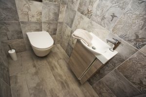 Toilet and tiled walls and basin display 1 by Ocean Bathrooms By Design in Salisbury