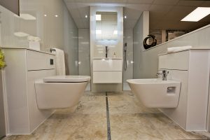Toilet over marbled floor and basin display 3 by Ocean Bathrooms By Design in Salisbury