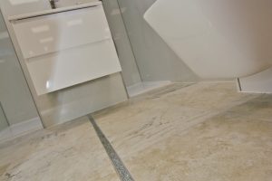 Marbled floor of bathroom display by Ocean Bathrooms By Design in Salisbury